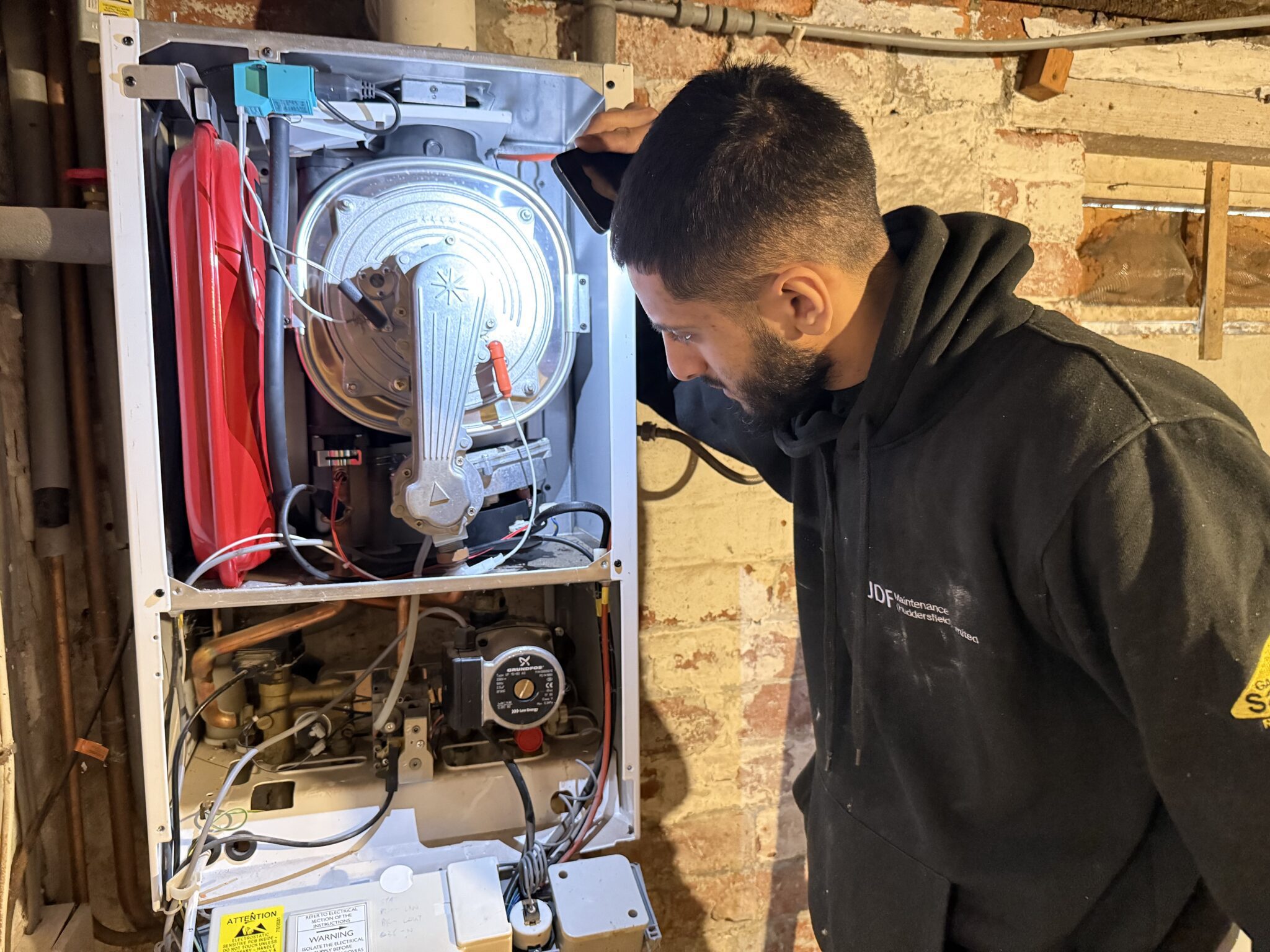 Gas Engineer conducting a Boiler repair in Huddersfield Gas Engineer conducting a Boiler repair in Huddersfield